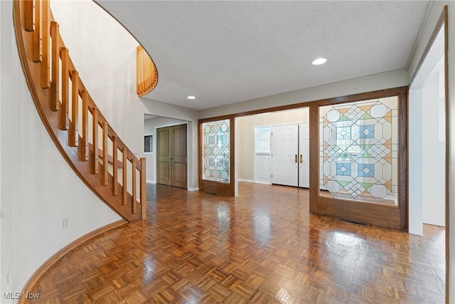 1820 Schneider St NW, North Canton, OH 44720 - foyer with baseboards, stairs, a textured ceiling, and recessed lighting