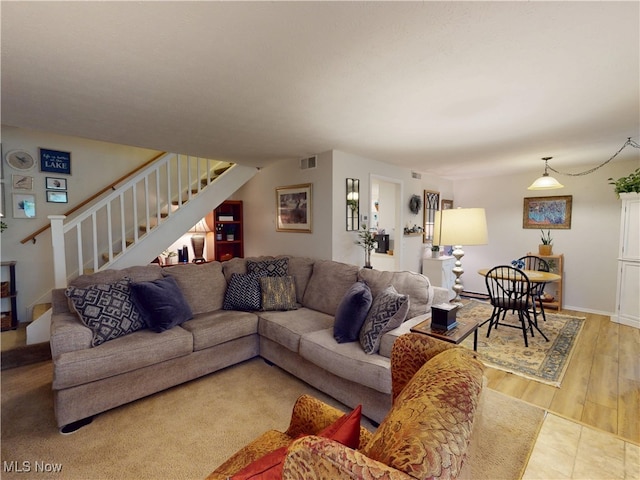 1651 Mentor Ave Unit 3002, Painesville, OH 44077 - living area with stairway and wood finished floors