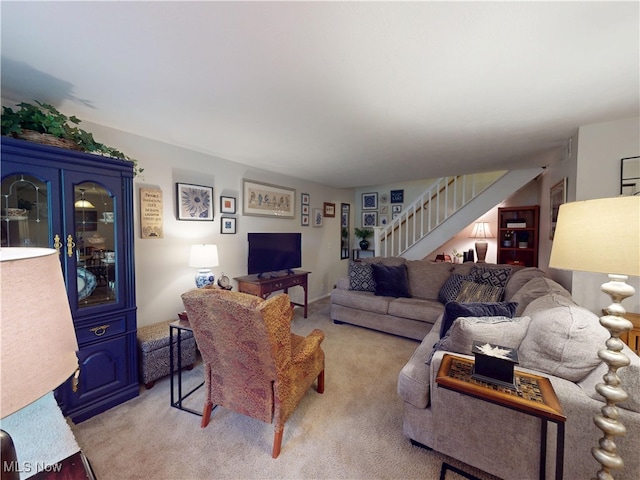1651 Mentor Ave Unit 3002, Painesville, OH 44077 - living room with stairway and light colored carpet