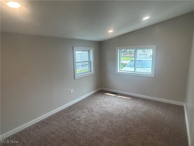 1706 Adams St, Coshocton, OH 43812 - carpeted empty room with baseboards and recessed lighting
