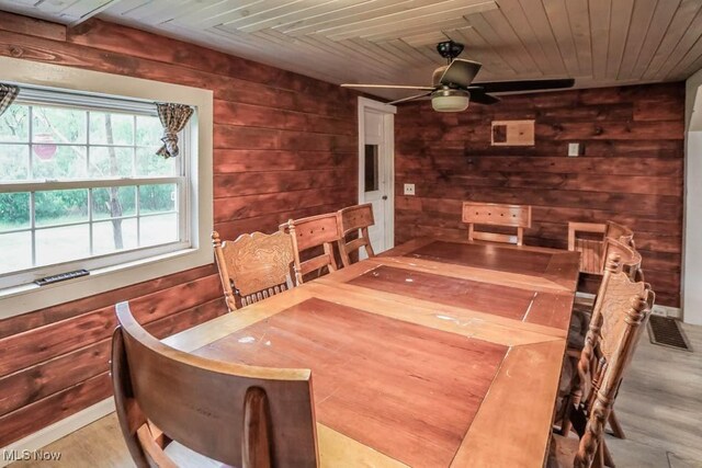 29655 Buck Rd, Salem, OH 44460 - dining space with wood finished floors, wood walls, wooden ceiling, and a ceiling fan