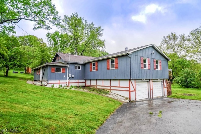 29655 Buck Rd, Salem, OH 44460 - view of front of house with driveway, a garage, and a front yard