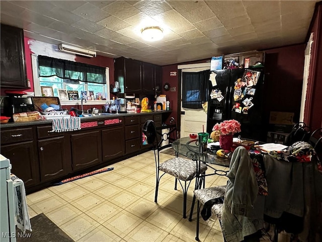1836 Colerain Pike, Martins Ferry, OH 43935 - kitchen with black refrigerator with ice dispenser, a sink, light floors, and dark countertops