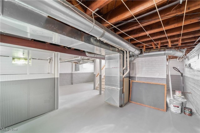 16209 Westdale Ave, Cleveland, OH 44135 - below grade area featuring electric panel, stairway, and heating unit