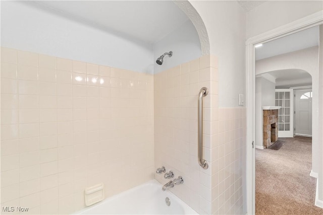 16209 Westdale Ave, Cleveland, OH 44135 - bathroom featuring bathtub / shower combination and a fireplace