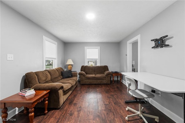 360 Woodside Ave NE, North Canton, OH 44720 - living room featuring healthy amount of natural light, dark wood-style floors, baseboards, and a textured ceiling