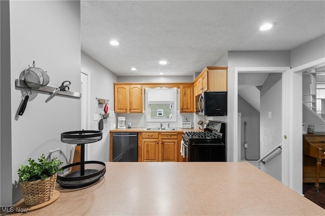 360 Woodside Ave NE, North Canton, OH 44720 - kitchen featuring gas stove, dishwasher, a sink, recessed lighting, and light countertops