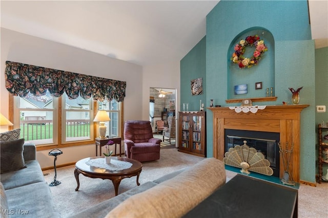 3645 Glen Eagles Blvd, Green, OH 44685 - carpeted living room featuring a glass covered fireplace, high vaulted ceiling, and baseboards