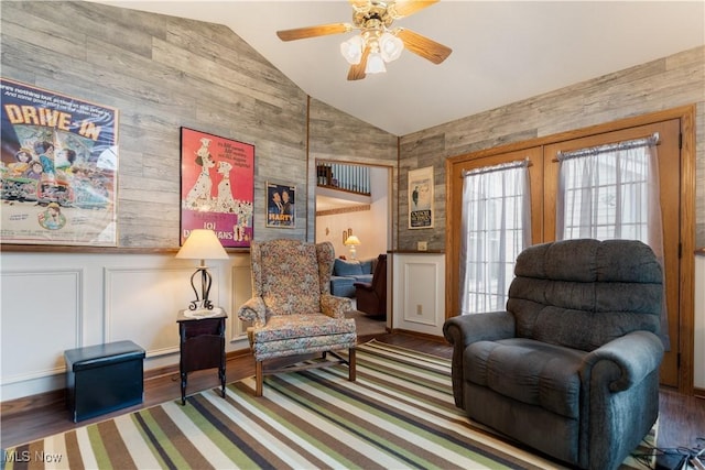 3645 Glen Eagles Blvd, Green, OH 44685 - living area with high vaulted ceiling, a ceiling fan, wood finished floors, wooden walls, and french doors