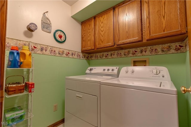 3645 Glen Eagles Blvd, Green, OH 44685 - laundry room with washing machine and dryer and cabinet space