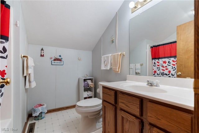 3645 Glen Eagles Blvd, Green, OH 44685 - full bathroom with vaulted ceiling, vanity, toilet, tile patterned floors, and curtained shower