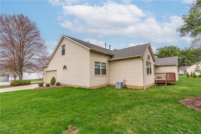 3645 Glen Eagles Blvd, Green, OH 44685 - view of side of property featuring concrete driveway, central AC unit, a yard, a wooden deck, and roof with shingles