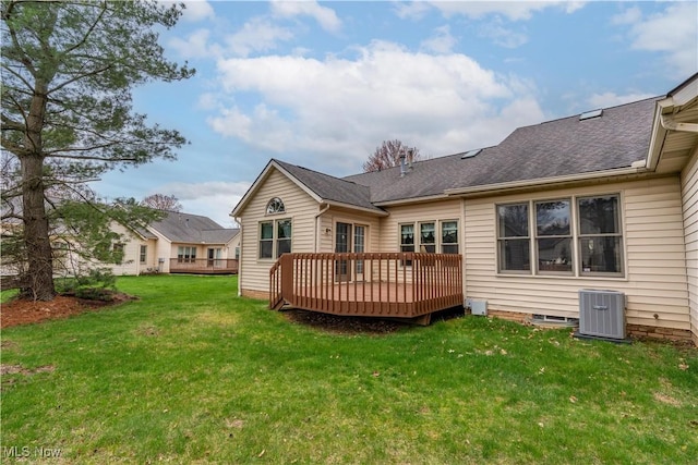 3645 Glen Eagles Blvd, Green, OH 44685 - rear view of house with central air condition unit, a deck, a lawn, and a shingled roof