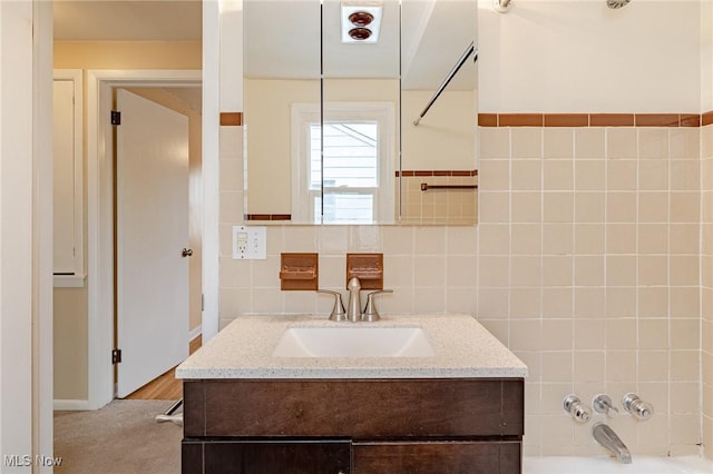 4092 Charlton Rd, South Euclid, OH 44121 - full bathroom with vanity, shower / bathtub combination, and tile walls