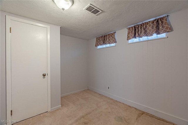 4092 Charlton Rd, South Euclid, OH 44121 - basement featuring light colored carpet, a textured ceiling, and baseboards