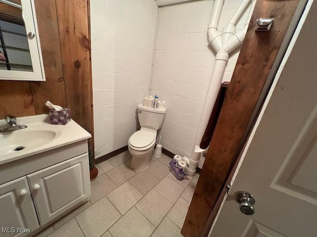 139 E Walnut St, Barnesville, OH 43713 - bathroom featuring vanity, toilet, and tile patterned flooring
