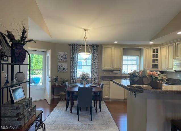 170 Sandy Ct Unit 11, New Middletown, OH 44442 - dining space with healthy amount of natural light, dark wood-type flooring, recessed lighting, and vaulted ceiling