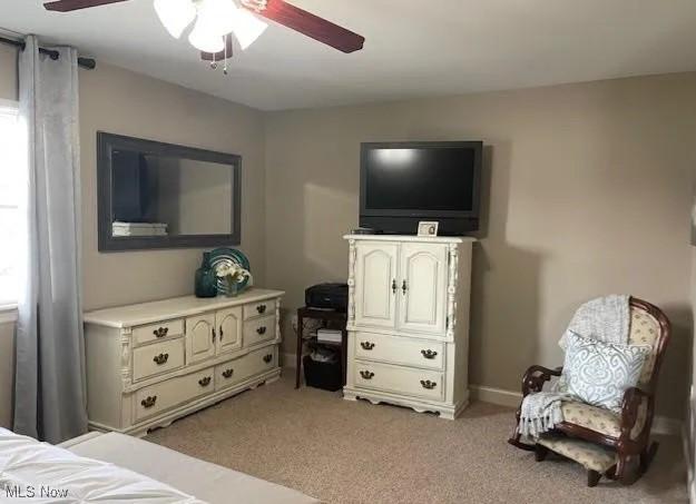 170 Sandy Ct Unit 11, New Middletown, OH 44442 - bedroom with light colored carpet, ceiling fan, and baseboards