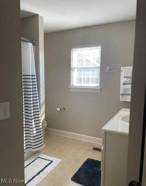 170 Sandy Ct Unit 11, New Middletown, OH 44442 - bathroom with baseboards, vanity, toilet, and a shower with curtain