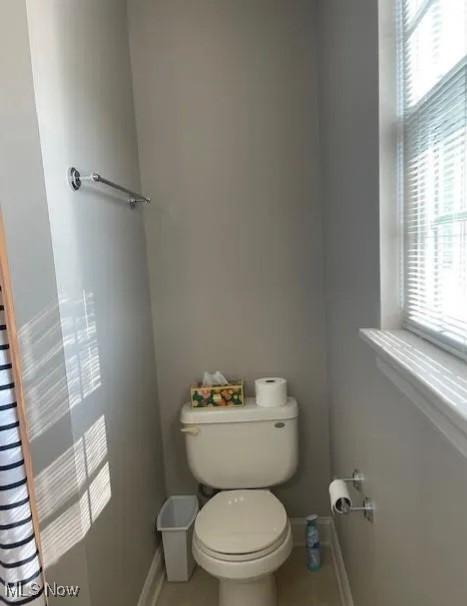 170 Sandy Ct Unit 11, New Middletown, OH 44442 - bathroom featuring baseboards, toilet, and tile patterned floors