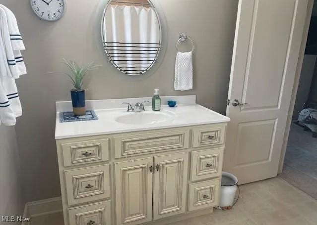 170 Sandy Ct Unit 11, New Middletown, OH 44442 - bathroom with vanity and tile patterned floors