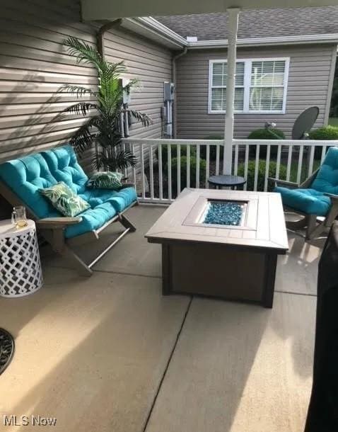 170 Sandy Ct Unit 11, New Middletown, OH 44442 - view of patio / terrace featuring an outdoor fire pit