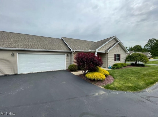 170 Sandy Ct Unit 11, New Middletown, OH 44442 - ranch-style home with a garage, asphalt driveway, and a front yard