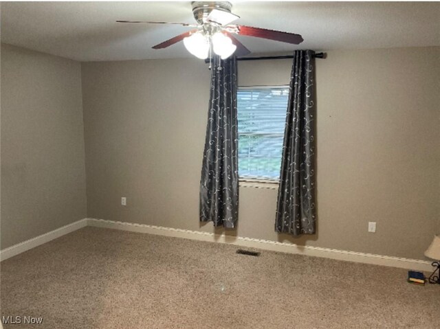 170 Sandy Ct Unit 11, New Middletown, OH 44442 - empty room with a ceiling fan, carpet, and baseboards