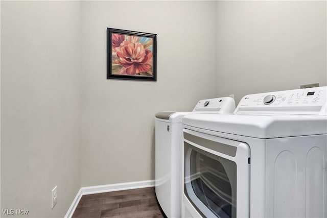 4527 Cupola Dr, Lorain, OH 44053 - laundry room with washer and dryer, dark wood finished floors, and baseboards