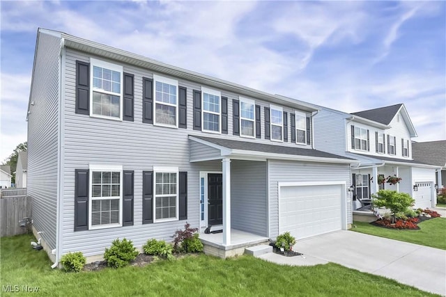 4527 Cupola Dr, Lorain, OH 44053 - view of front of house with concrete driveway, an attached garage, and a front lawn
