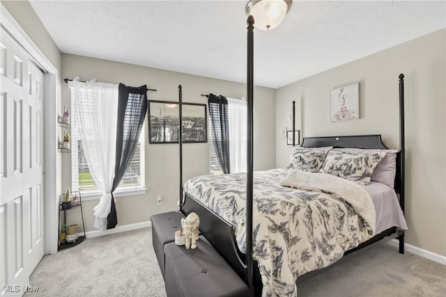 4527 Cupola Dr, Lorain, OH 44053 - carpeted bedroom featuring multiple windows, baseboards, and a closet
