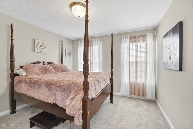 4527 Cupola Dr, Lorain, OH 44053 - carpeted bedroom featuring baseboards and a textured ceiling