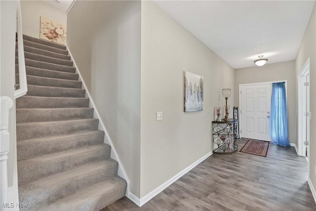 4527 Cupola Dr, Lorain, OH 44053 - entrance foyer featuring stairs, wood finished floors, and baseboards