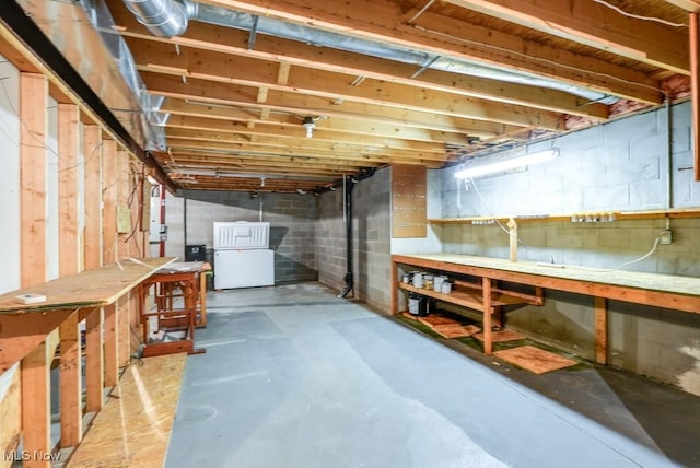 835 Thelma Dr, Wadsworth, OH 44281 - unfinished basement with a workshop area, fridge, and gas water heater
