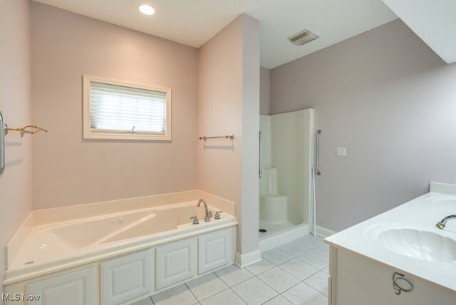 835 Thelma Dr, Wadsworth, OH 44281 - bathroom featuring a bath, tile patterned flooring, a stall shower, double vanity, and baseboards