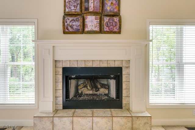 835 Thelma Dr, Wadsworth, OH 44281 - detailed view of a tile fireplace and baseboards
