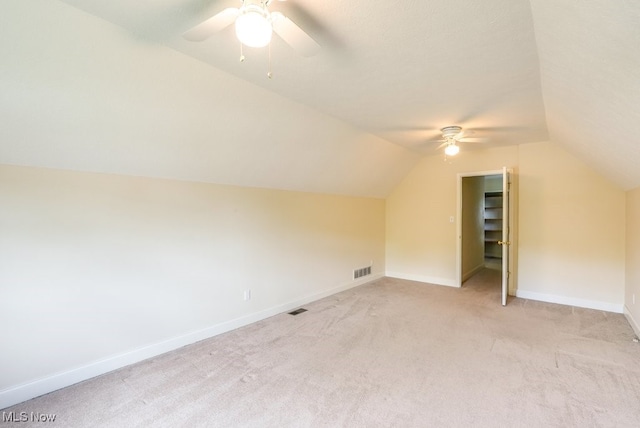 835 Thelma Dr, Wadsworth, OH 44281 - bonus room with a ceiling fan, vaulted ceiling, light carpet, and baseboards