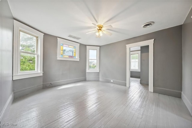 3399 E 65th St, Cleveland, OH 44127 - empty room featuring hardwood / wood-style flooring, ceiling fan, and baseboards