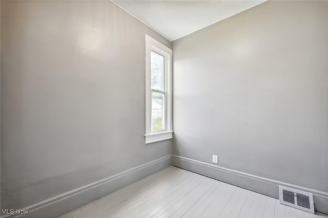 3399 E 65th St, Cleveland, OH 44127 - empty room with light wood-style flooring and baseboards
