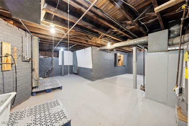 3399 E 65th St, Cleveland, OH 44127 - unfinished below grade area featuring brick wall
