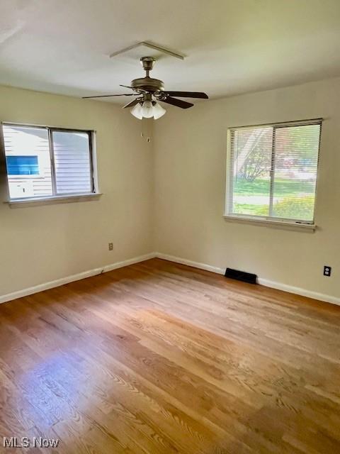 201 Valleyview Dr, Kent, OH 44240 - empty room featuring wood finished floors, baseboards, and ceiling fan
