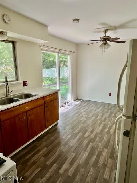 201 Valleyview Dr, Kent, OH 44240 - kitchen with freestanding refrigerator, a sink, dark wood-style flooring, and light countertops