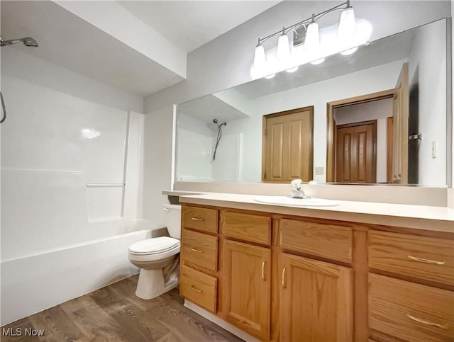 23135 Grist Mill Ct Unit 29C, Olmsted Falls, OH 44138 - full bath featuring wood finished floors, vanity, toilet, and bathtub / shower combination