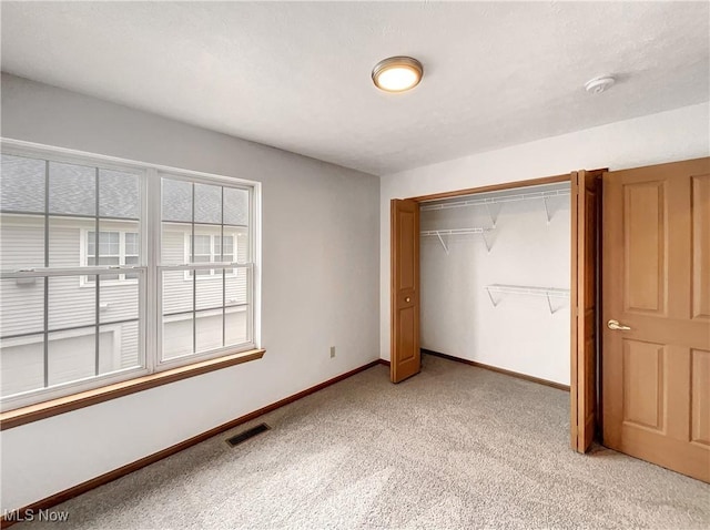 23135 Grist Mill Ct Unit 29C, Olmsted Falls, OH 44138 - unfurnished bedroom with light colored carpet, a closet, and baseboards