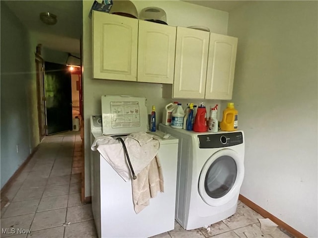 9439 Williams Rd, Diamond, OH 44412 - washroom featuring cabinet space, baseboards, and light tile patterned floors