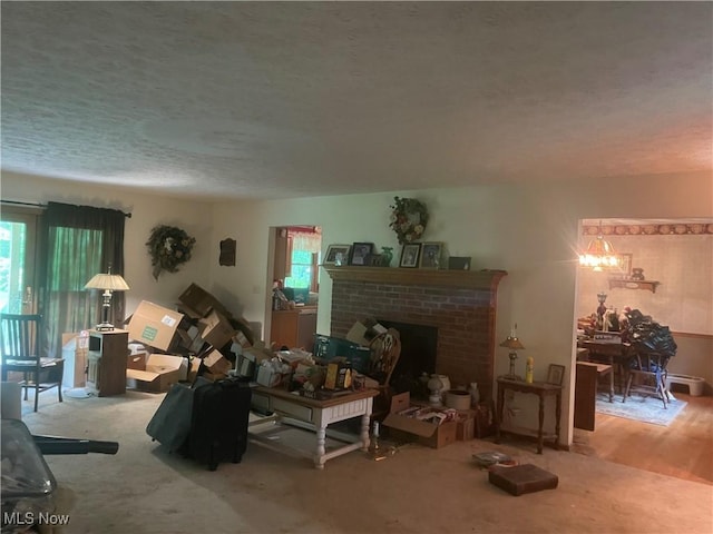 9439 Williams Rd, Diamond, OH 44412 - living area with plenty of natural light, a textured ceiling, and a fireplace