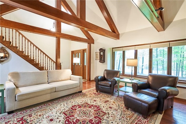 5074 Tall Timbers Dr, Richfield, OH 44286 - living room with beam ceiling, wood finished floors, stairway, and high vaulted ceiling