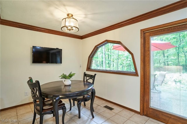 5074 Tall Timbers Dr, Richfield, OH 44286 - dining room with plenty of natural light, crown molding, baseboards, and light tile patterned flooring