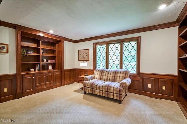5074 Tall Timbers Dr, Richfield, OH 44286 - sitting room with wainscoting, ornamental molding, carpet floors, a decorative wall, and built in shelves