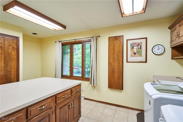 5074 Tall Timbers Dr, Richfield, OH 44286 - washroom featuring cabinet space, independent washer and dryer, baseboards, and light tile patterned flooring